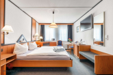 Doppelzimmer - Modernisiertes Immobilienensemble mit Entwicklungspotenzial für Wohnen & Apartments